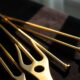 Tuning forks on velvet illustrate How to Stop Negative Self-Talk, Rewire Inner Voice