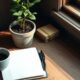 Small desk with notebook and plant for improving customer retention strategies