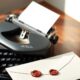 Classic typewriter and sealed envelope representing how to write a guest post for Mindshelves