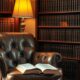 Leather armchair and bookshelf of hardcover volumes representing best books on business strategy for entrepreneurs