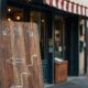 Neighbourhood shopfront with sandwich board showing how to use local SEO to attract more customers