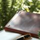 Open journal and compass on a garden bench illustrating personal development plan for career growth