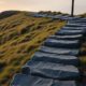 Misty hillside staircase at dawn representing self discipline to achieve long term goals
