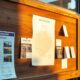 Community noticeboard outside small shop illustrating digital marketing strategy for a small business